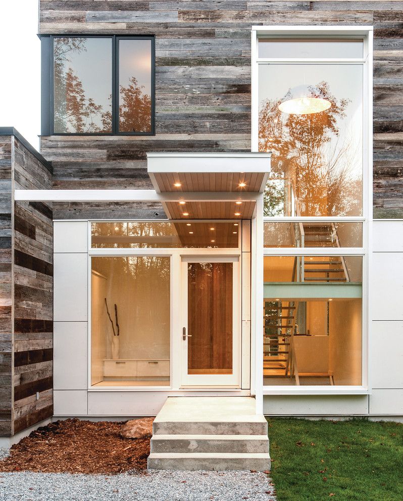 Clap Board for a Modern Entry with a Gravel Path and Gatineau Hills by Marvin Windows and Doors