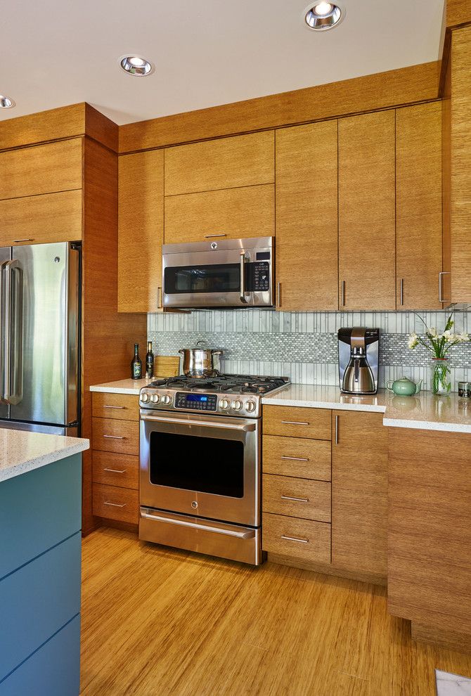 Clayton Appliance for a Contemporary Kitchen with a Rift Cut Oak Cabinets and 1990's Home Update by Charmaine Manley Design