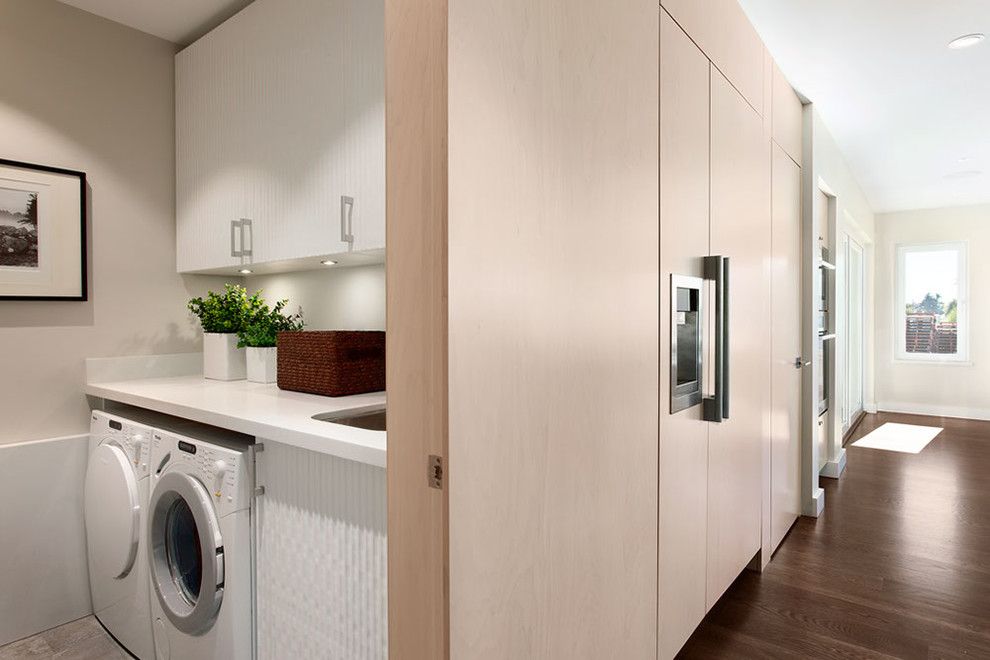 Cleaning Front Load Washer for a Contemporary Laundry Room with a Closet Laundry Room and Portfolio by Sensitive Design Inc.