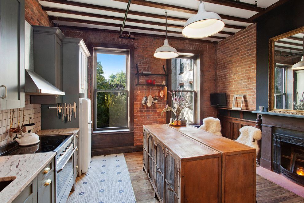 Cleaning Wood Floors with Vinegar for a Eclectic Kitchen with a Exposed Brick and Madison Avenue by Goosenest Interior Design