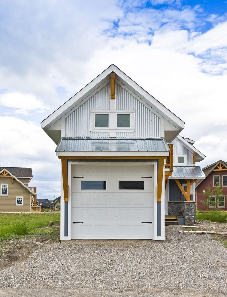 Cmc Construction Services for a Eclectic Garage with a White Garage Door and Exterior Photos by Sticks and Stones Design Group Inc.