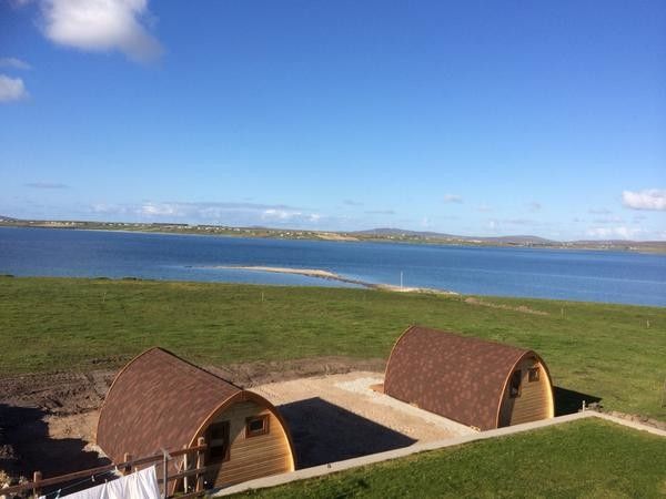 Coast Guard Emblem for a Beach Style Spaces with a Beach Style and Belmullet Coast Guard Station by Pods Ireland