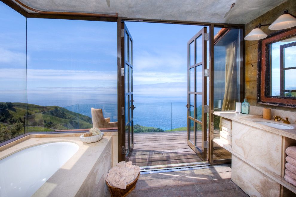 Coastline Realty for a Mediterranean Bathroom with a Rustic Wood Floor and Big Sur Coast Ridge Estate by Decker Bullock Sotheby's International Realty