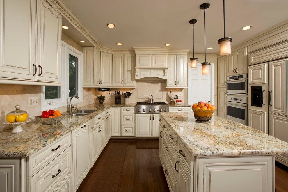 Colonial Marble and Granite for a Traditional Kitchen with a Dark Hardwood and a Kitchen Designed for Family Gathering by Michael Nash Design, Build & Homes