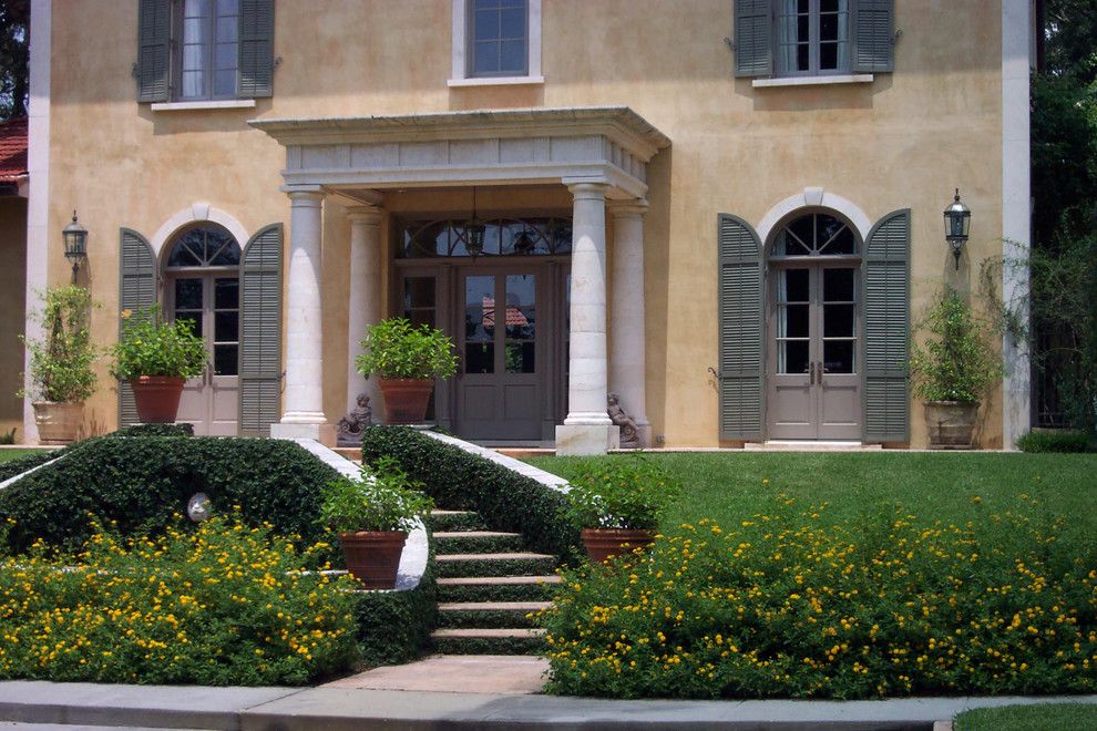 Colonnade Atlanta for a Mediterranean Exterior with a Macedonia Limestone Columned Entry with Entablature and Front View of Tuscan Style Villa by Bella Dura Architectural Stone