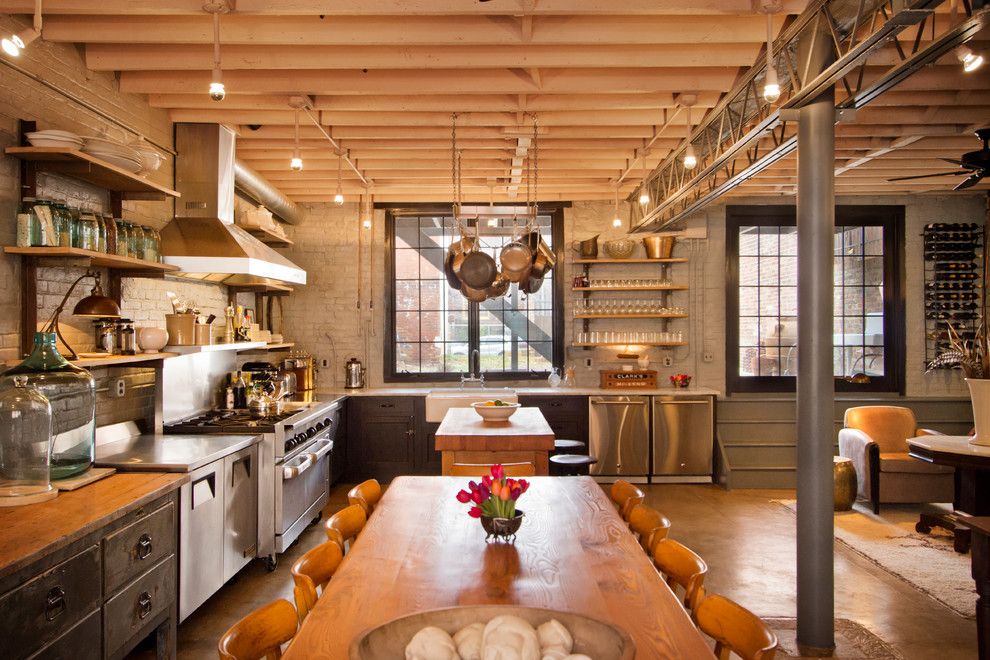 Concrete Masonry Unit for a Industrial Kitchen with a Rectangular Dining Table and Kitchen & Dining Room by Bennett Frank Mccarthy Architects, Inc.