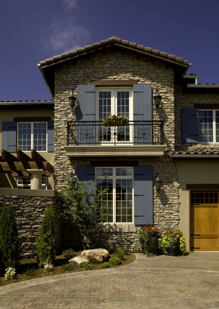 Conex Box Homes for a Mediterranean Exterior with a Stacked Stone and 2008 Parade of Homes House by Lawrence Architecture, Inc.