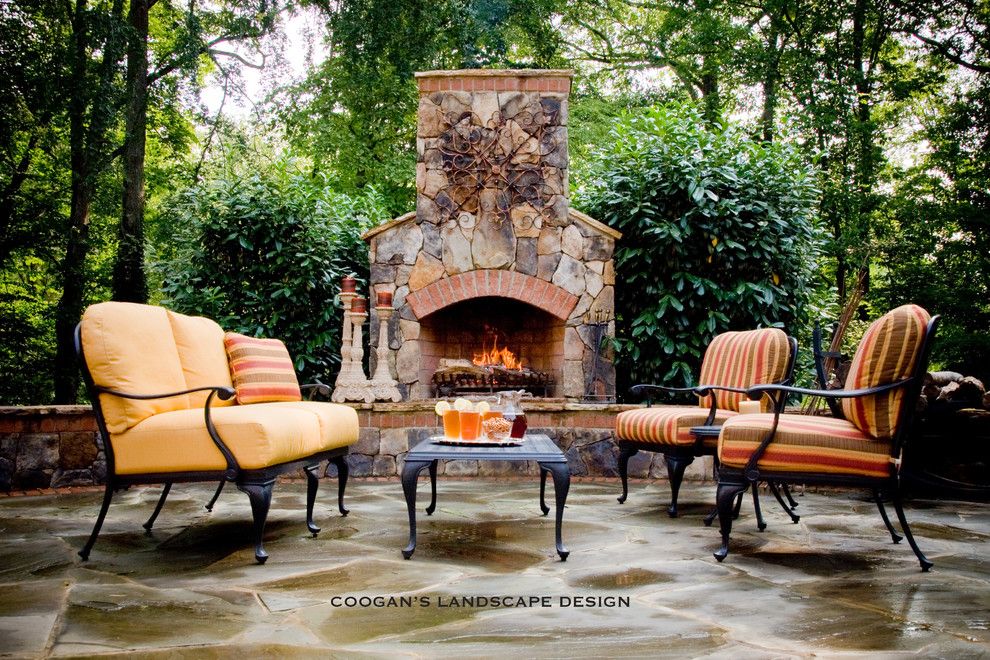 Coogans for a  Spaces with a Stone Fireplace and Outdoor Fireplaces by Coogan's Landscape Design