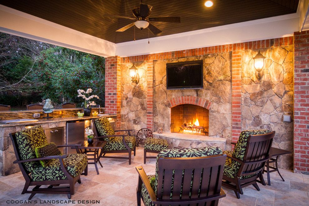 Coogans for a Traditional Patio with a Stone Fireplace and Outdoor Fireplaces by Coogan's Landscape Design
