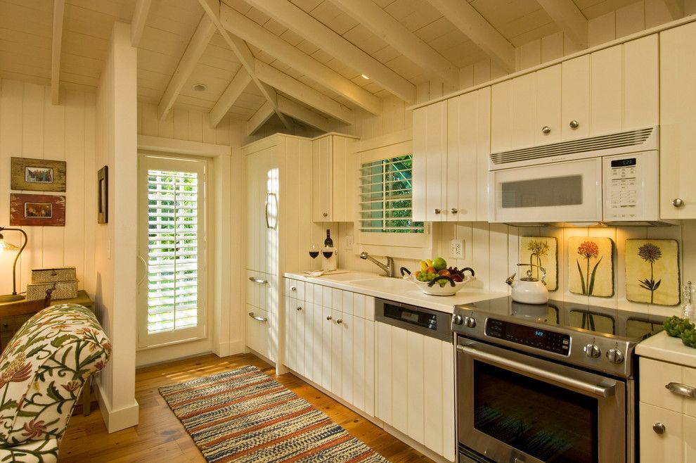 Cookson Doors for a Tropical Kitchen with a Striped Runner and Ldl Interiors Lynn Lombardi Naples Fl by Randall Perry Photography