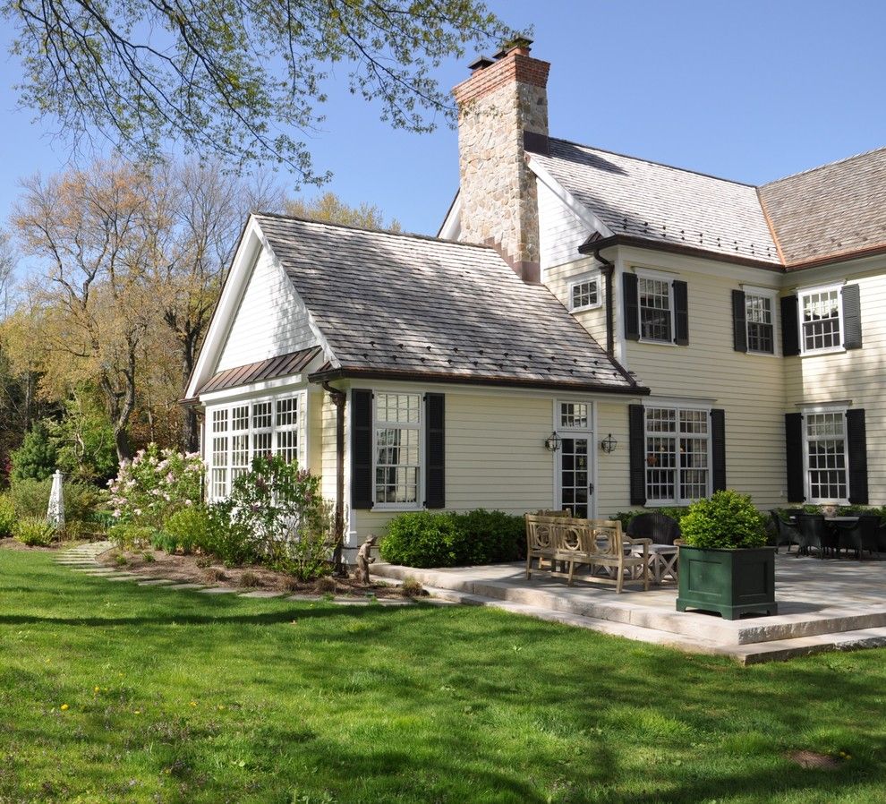 Copper Chimney for a Traditional Exterior with a Rock Chimney and Patio by Scandic Builders, Inc.