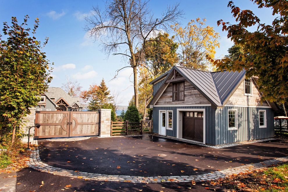 Cordovan Color for a Transitional Garage with a Board and Batten Siding and Custom Waterfront Home Barrie by Madison Taylor