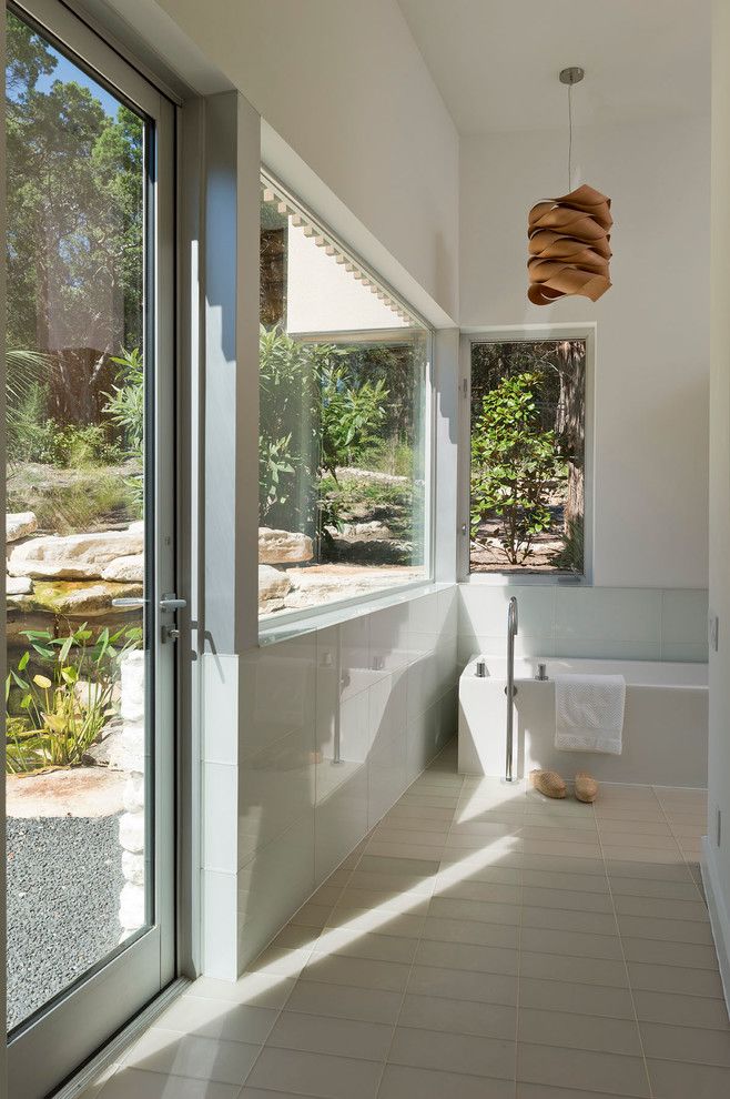 Corepower Yoga Austin for a Modern Bathroom with a Glass Tiles and Austin Modern Home by Foursquare Builders