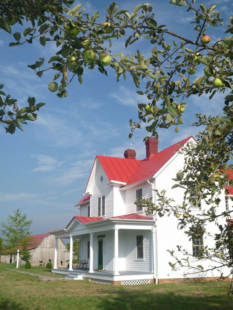 Coronado Paint for a Farmhouse Exterior with a Metal Roof and Farmhouse Exterior by Outlawdesigncompany.com