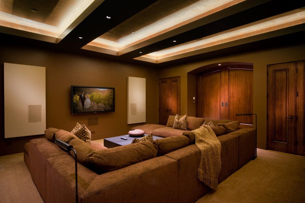 Counch for a Contemporary Home Theater with a Brown Throw Pillow and Pebble Beach Modern by Michelle Pheasant Design, Inc.