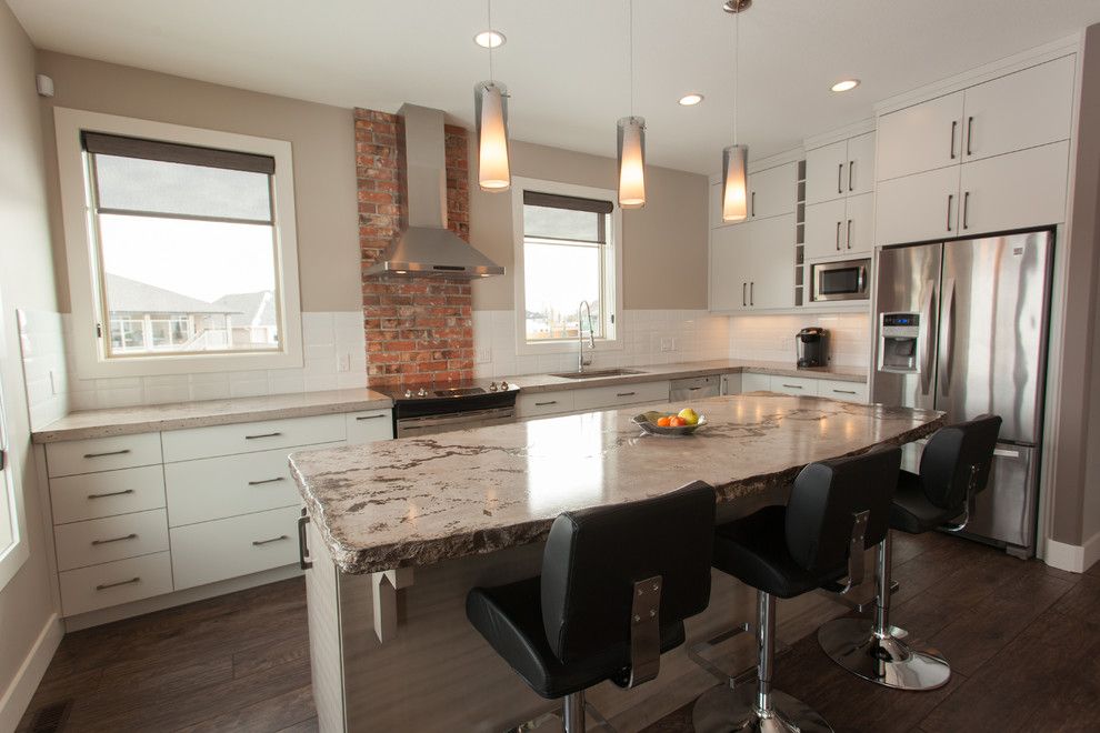 Cutting Edge Granite for a Contemporary Kitchen with a Brick Backsplash and Custom Design 1 by Matters of Design Inc.