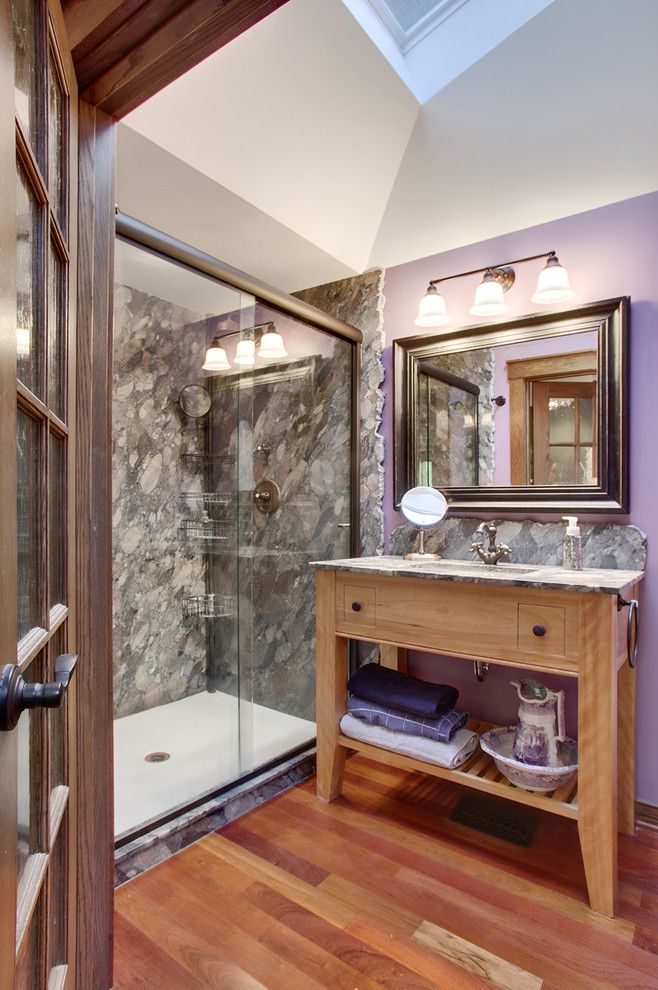 Cutting Edge Granite for a Traditional Bathroom with a Triple Wall Sconce and Picnic Point Remodel by Brook and Company