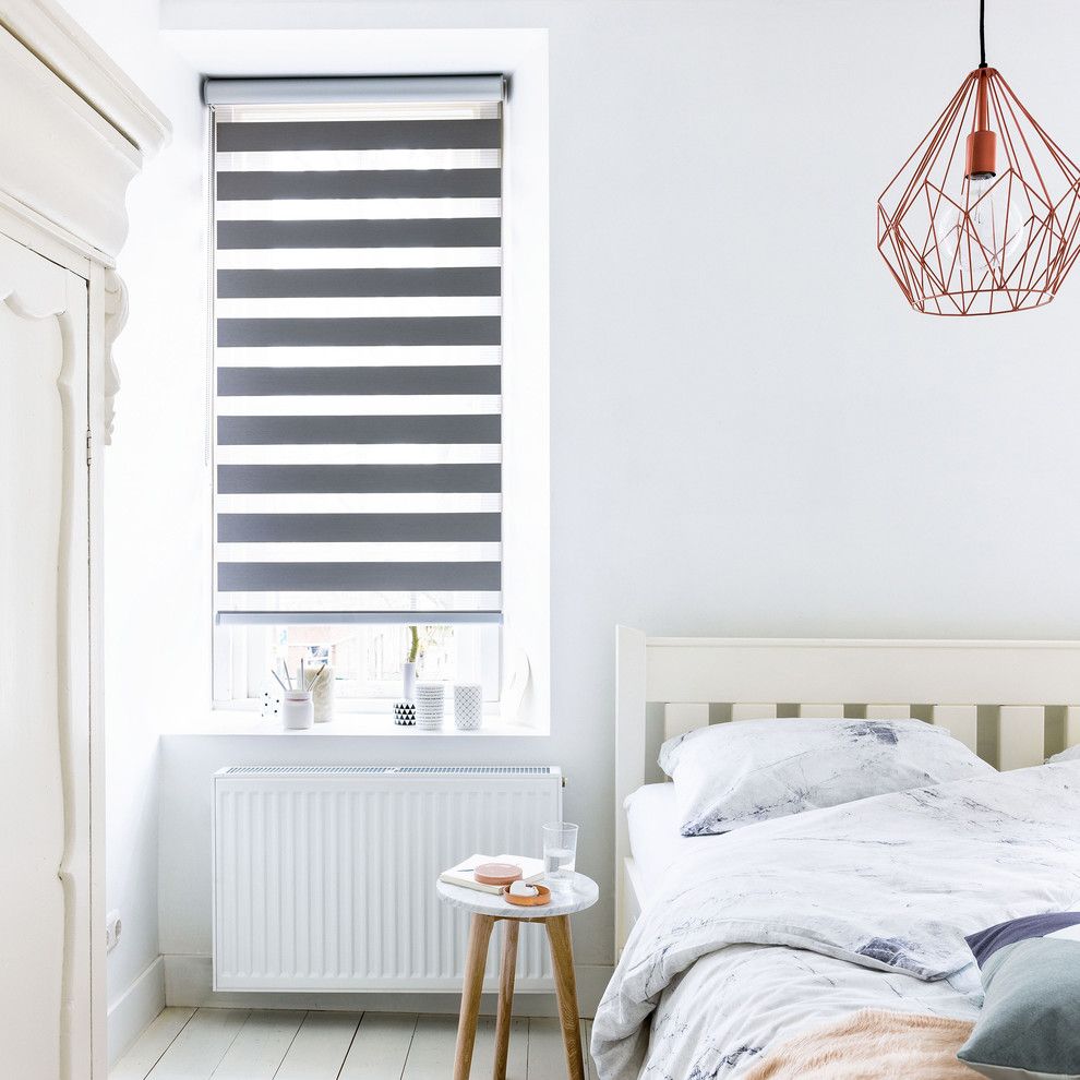 Decluttering Your Home for a Contemporary Bedroom with a Wire Pendant and Budget Blinds by Budget Blinds