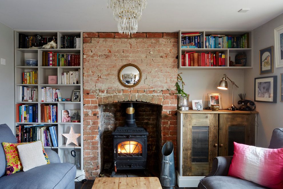 Decluttering Your Home for a Eclectic Living Room with a Crystal Chandelier and Wren Cottage by Hart Design and Construction