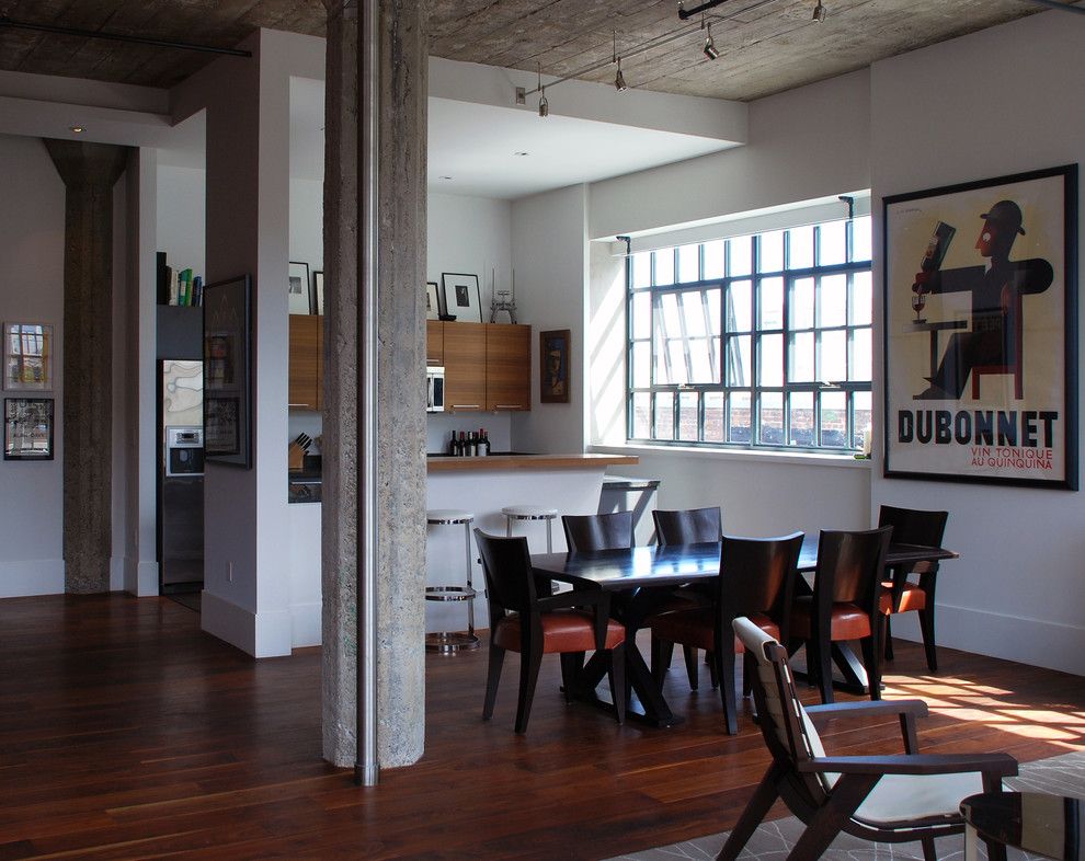 Demising Wall for a Modern Dining Room with a Concrete Columns and South Park Loft by Ccs Architecture