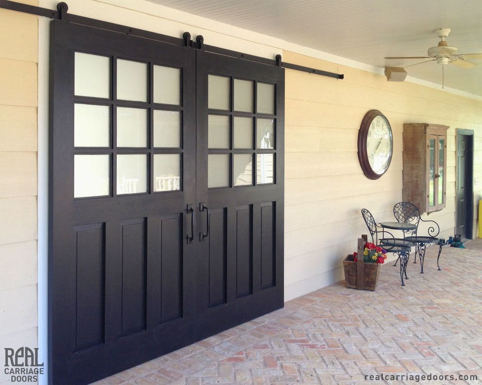 Door Jambs for a Traditional Patio with a Sliding Hardware and Exterior Sliding Barn Doors by Real Carriage Door Company