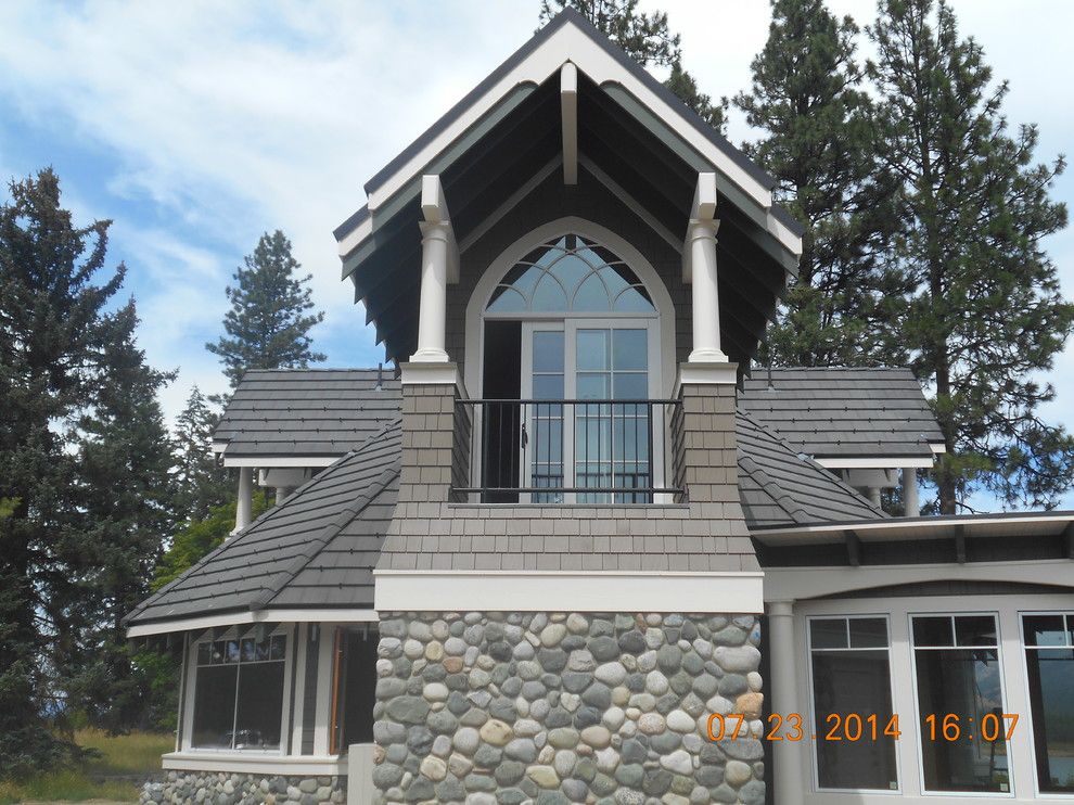 Eagle Roofing for a Transitional Exterior with a Medium Wood Entry Door and Master Suite Addition by Eaglepointe Construction & Management