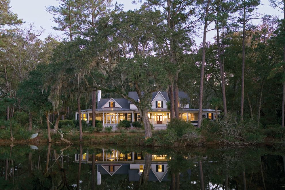 Earth Sheltered Homes for a Tropical Exterior with a Black and White and Carpenter Gothic Cottage | Spring Island, South Carolina by Historical Concepts