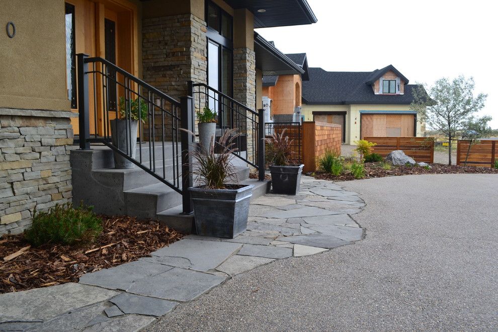 Earthled for a Traditional Landscape with a Flagstone Walkway and T/m Residence by Earthlings Inc.