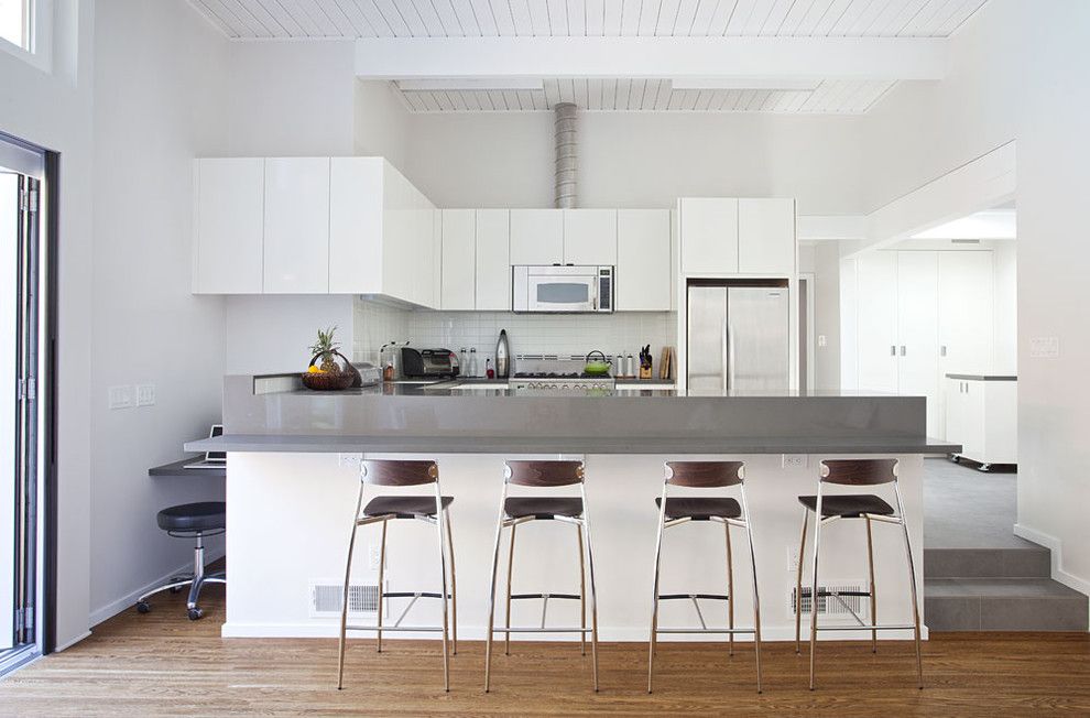 Eichler House for a Midcentury Kitchen with a Kitchen Island and Kitchen From Family Room by Klopf Architecture