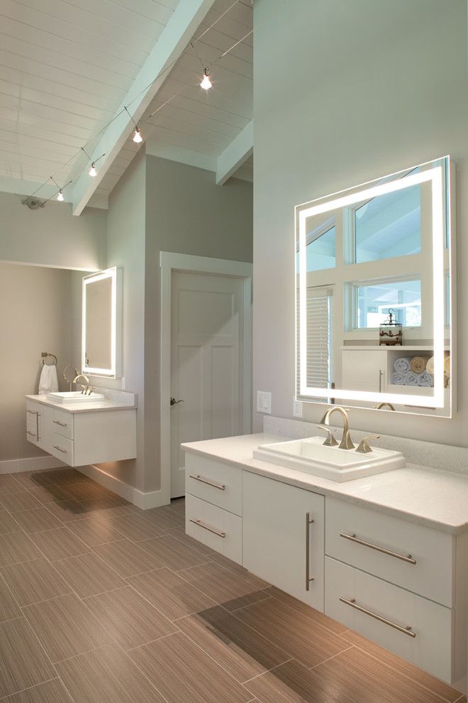 Electric Company Cast for a Contemporary Bathroom with a Lighted Mirror and Greene County Master Bathroom by Nest Designs Llc