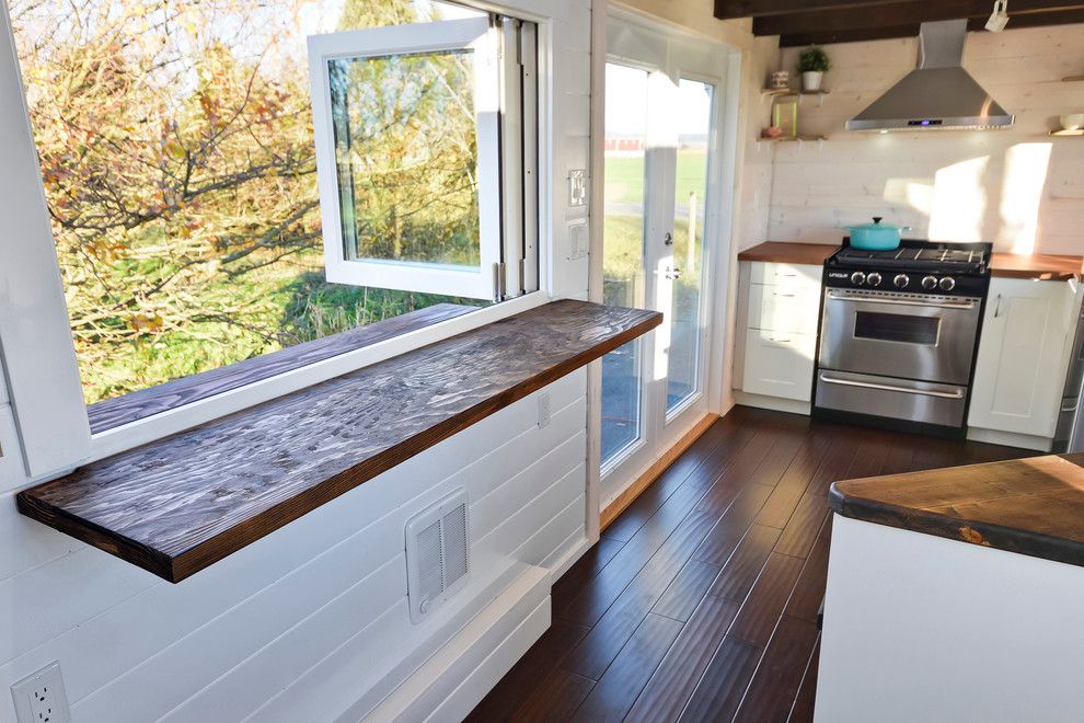 Electric Company Cast for a Farmhouse Spaces with a Farmhouse and Custom Tiny Home by Mint Tiny House Company