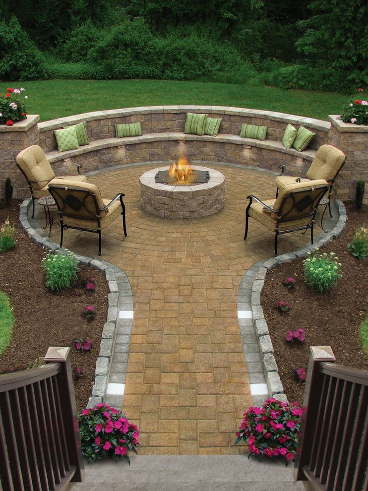 Electric Company Cast for a Traditional Patio with a Green Throw Pillows and Fire Pit by Conklin Limestone