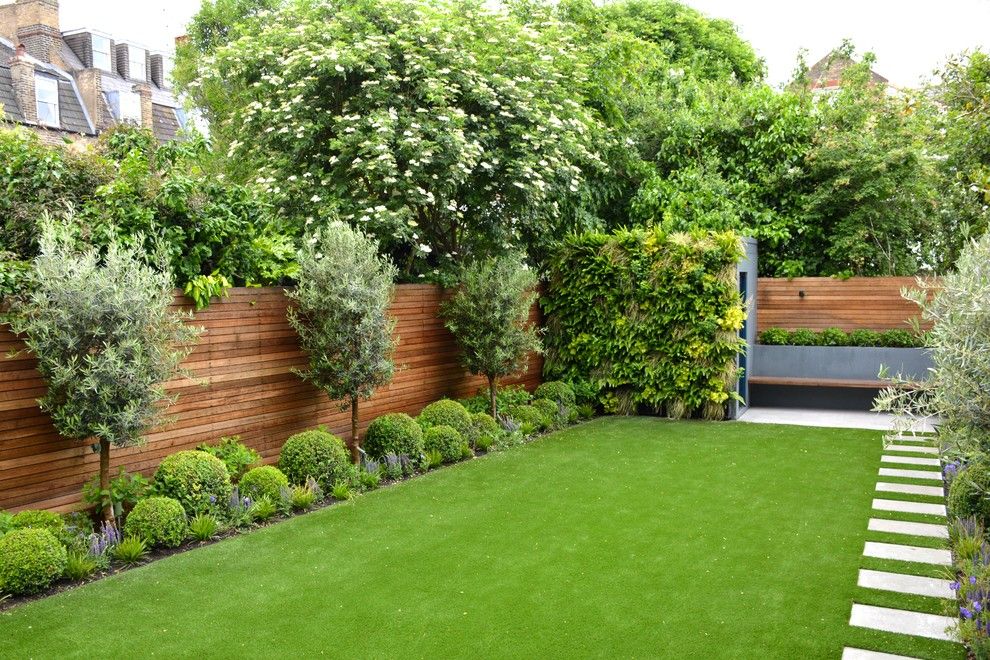 Espalier Fruit Trees for a Contemporary Landscape with a Wooden Fence and Fulham Garden by Tom Howard Garden Design and Landscaping