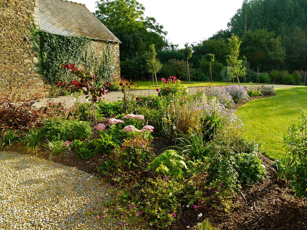 Espalier Fruit Trees for a Farmhouse Landscape with a Farmhouse and Project on a Sloping Site by Landscapes & Cie