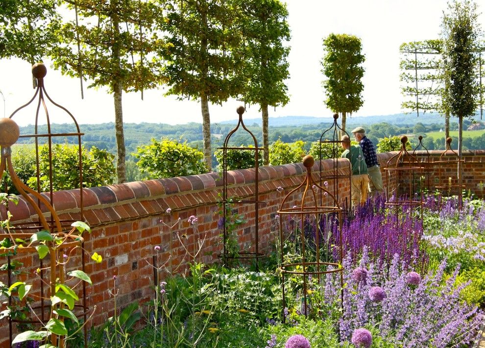 Espalier Fruit Trees for a Traditional Landscape with a Allium and Brede Valley by Marian Boswall Landscape Architects