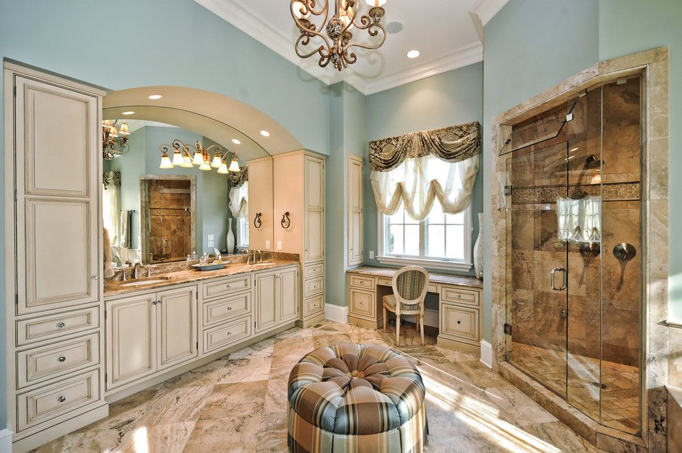 Fabric Stores Charlotte Nc for a Traditional Bathroom with a Beige Stone Floor and English Tudor by Benham Builders