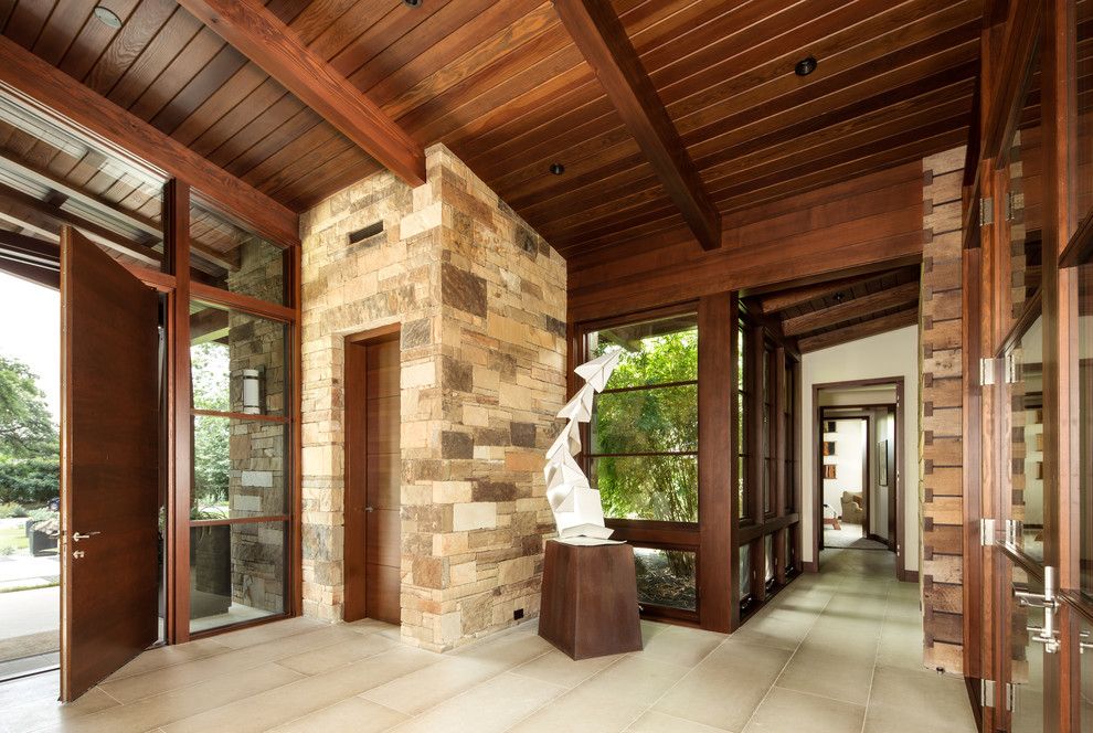 Famous Contemporary Artists for a Rustic Entry with a Beige Stone and Tarryhill Place by Ryan Street & Associates