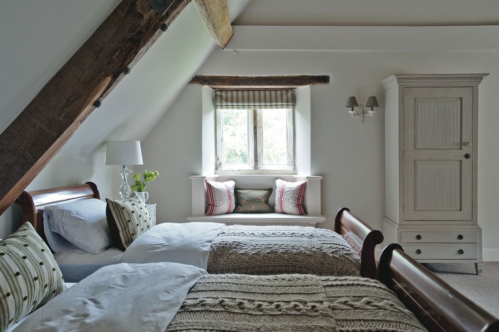 Farmgirl Flowers for a Farmhouse Bedroom with a Exposed Beams and Dorset Manor House by Sims Hilditch