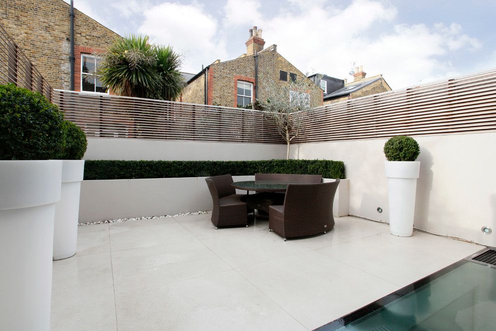 Fenceworks for a Contemporary Patio with a Paved Patio and Contemporary Patio by Veronicacongdondesign.co.uk