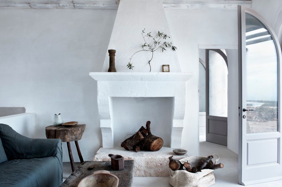 Fireplace Fashions for a Mediterranean Living Room with a White Living Room and Masseria Petrarolo Italy by Alexander Waterworth Interiors Ltd