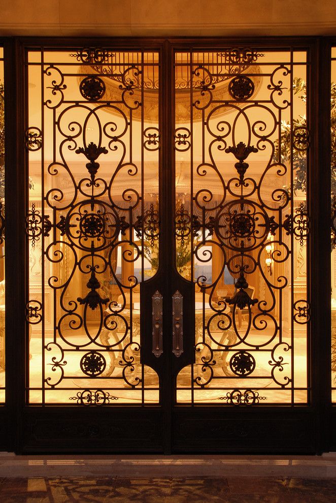 French Chateau for a Traditional Entry with a Iron Entry Doors and French Chateau by Roy Sklarin Interiors