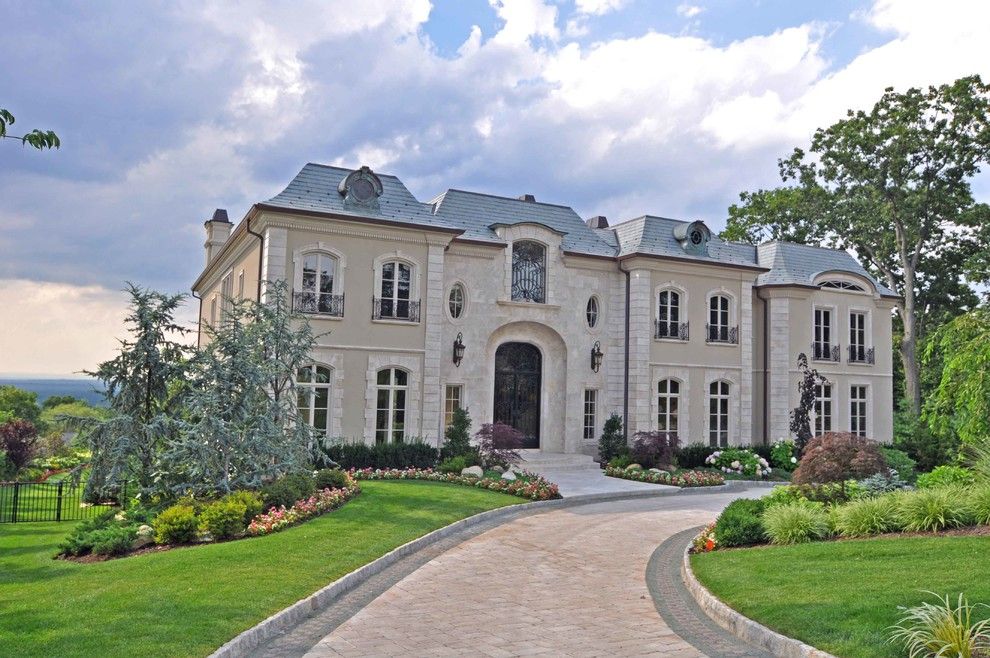 French Chateau for a Traditional Exterior with a Exposed Brick and French Chateau by Joe Commorata