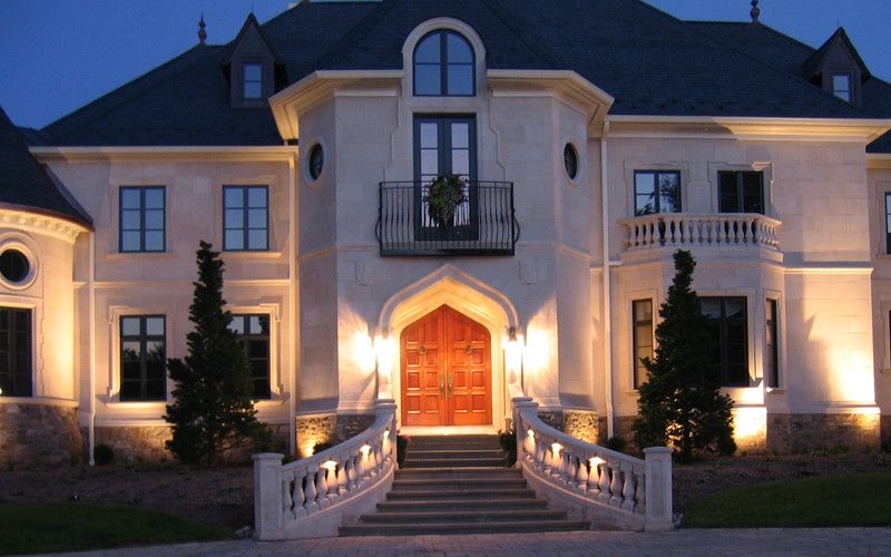 French Chateau for a Traditional Exterior with a Turrets and French Chateau Night Entry by Omnia Group Architects