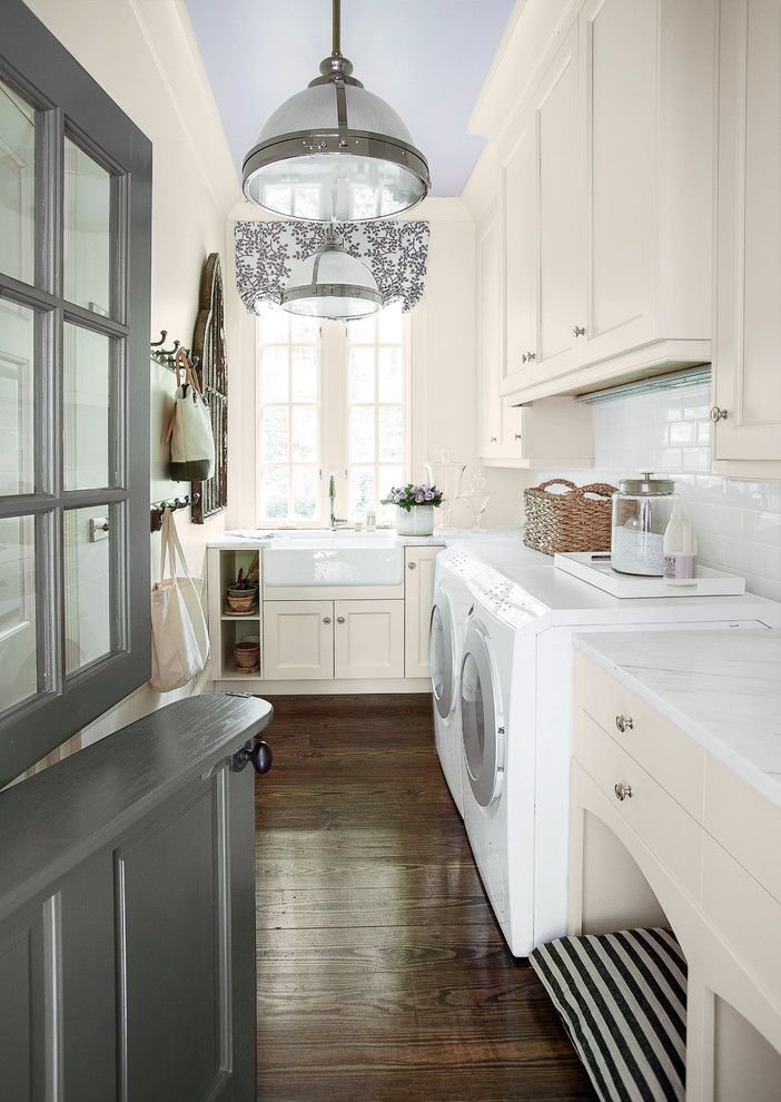 Front Load Washer Smell for a Traditional Laundry Room with a Front Loading Washer and Dryer and Painted Ceiling by Southern Living