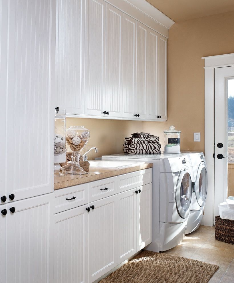 Front Load Washer Smell for a Traditional Laundry Room with a White Cabinets and Dewils Laundry Room by Dewils Custom Cabinetry