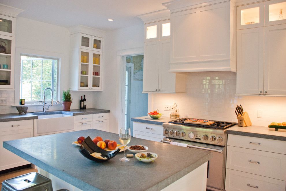 Front Range Lumber for a Farmhouse Kitchen with a Beige Tile Backsplash and Bridge Farmhouse by Jason Thomas Architect