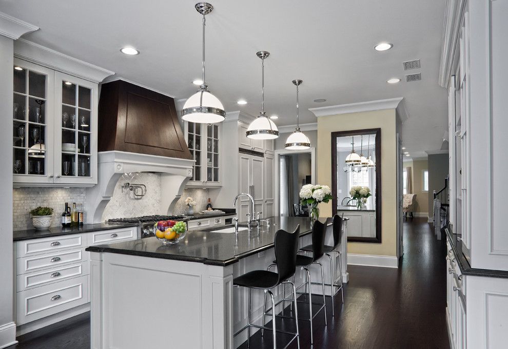 Front Range Lumber for a Traditional Kitchen with a Pendant Lights and Elegantly Detailed Kitchen by Tzs Design