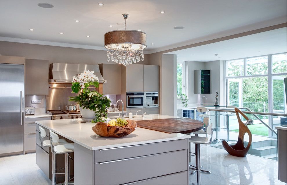 Fruit Flies in Kitchen for a Transitional Kitchen with a White Worktop and Making the Most of a Challenging, Sloping Site to Create an Elegant Yet Function by Des Ewing Residential Architects