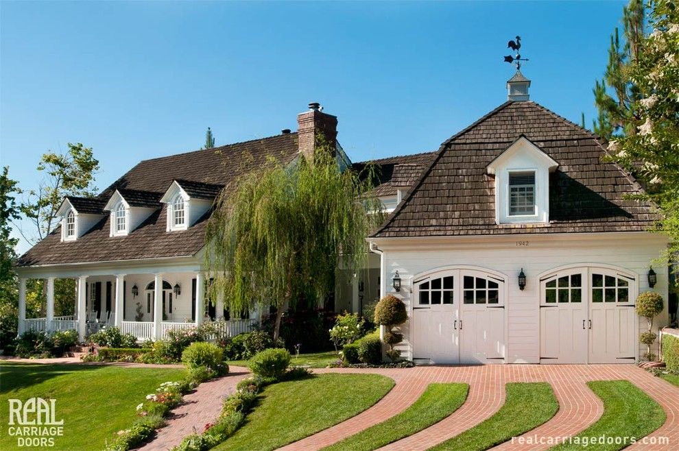 Garagetek for a Traditional Shed with a Garage Doors and Arched Wood Carriage Garage Doors by Real Carriage Door Company