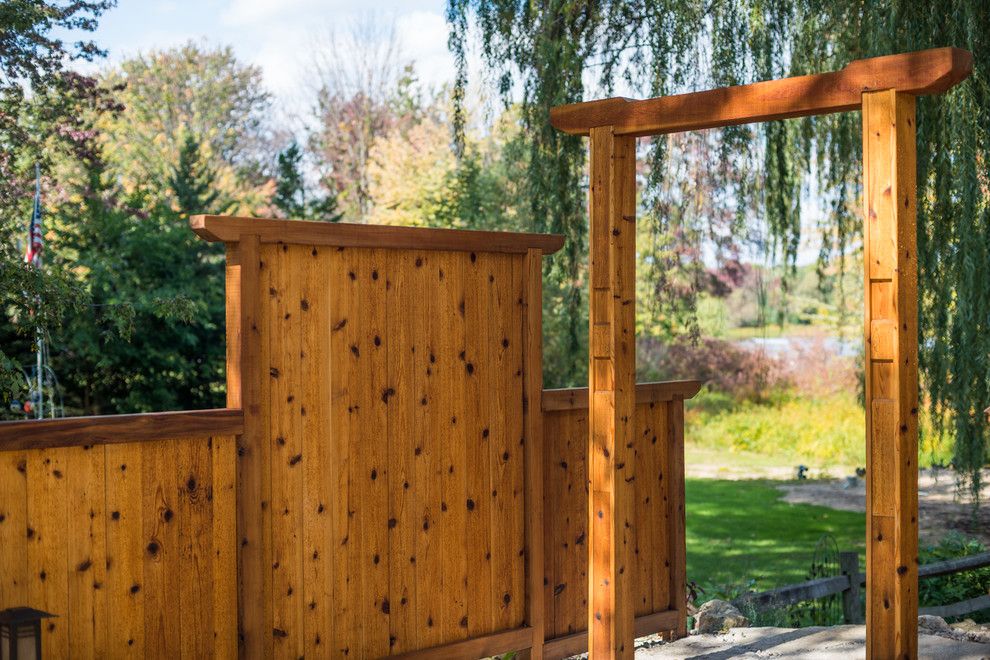 Gardenscapes for a Asian Landscape with a Ann Arbor and Japanese Style Cedar Gate by Lotus Gardenscapes & Bloom Garden Center